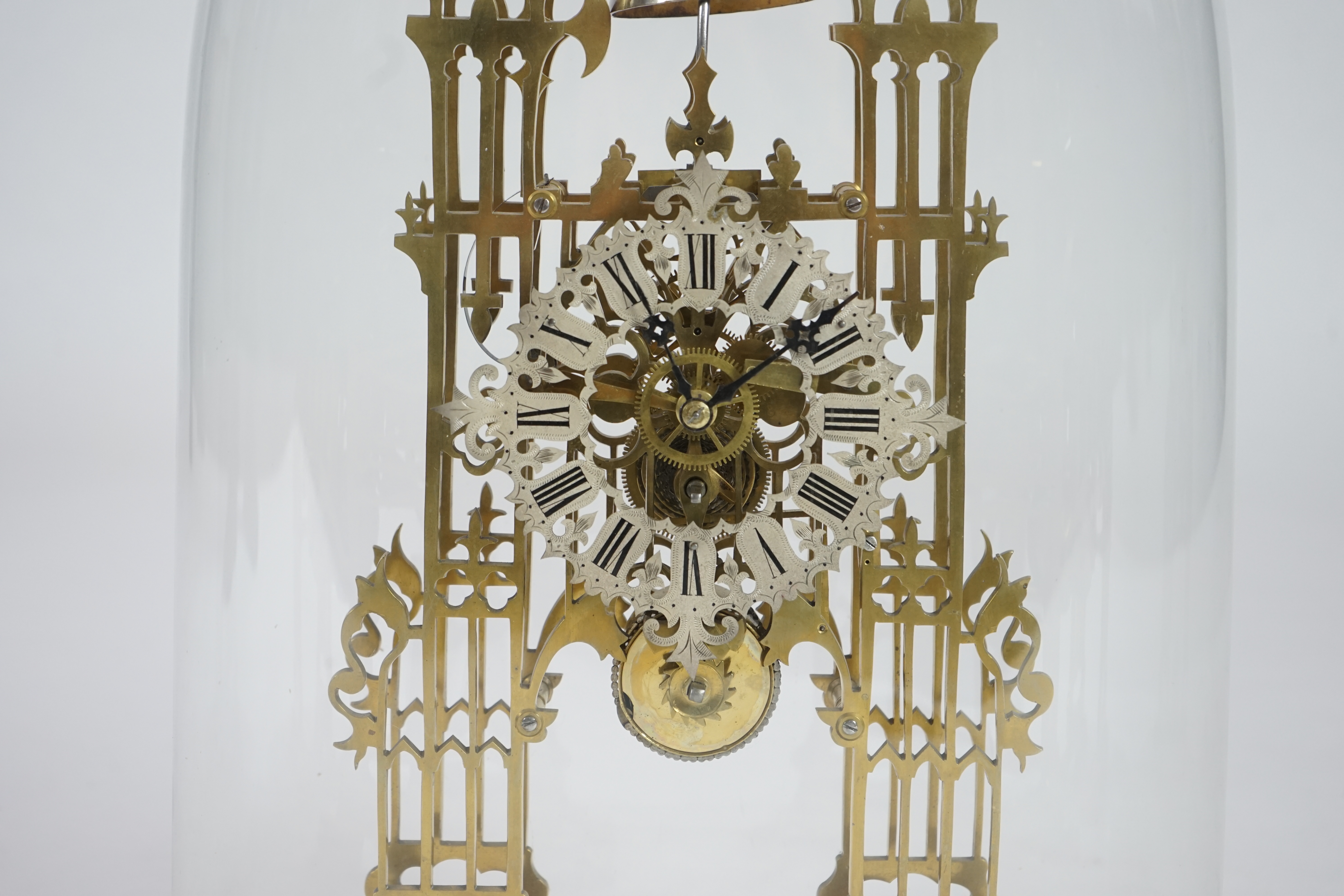 A Victorian brass cathedral front skeleton clock